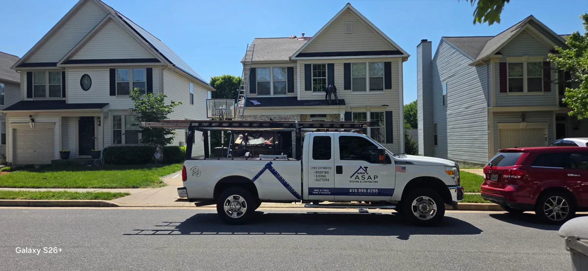 ASAP Roofing & Contracting truck on a residential roofing job in the Baltimore, MD area.